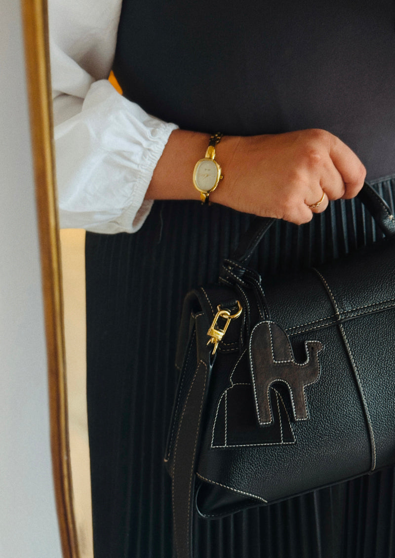 pendentif sac dromadaire en cuir noir