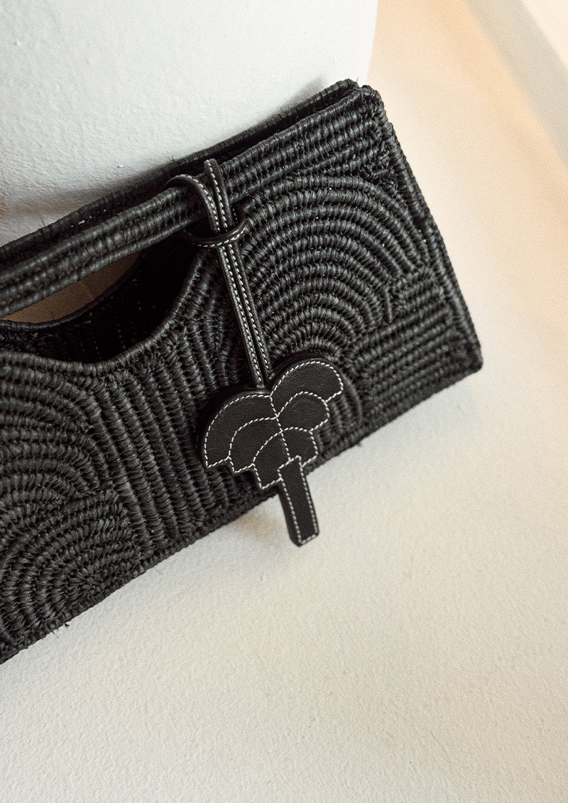 pendentif sac palmier signature en cuir noir